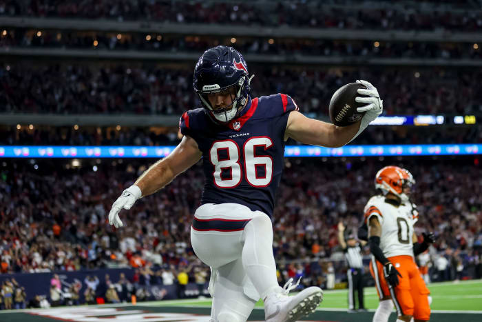 Jan 13, 2024; Houston, Texas, USA; Houston Texans tight end Dalton Schultz (86) scores a touchdown during the second quarter in a 2024 AFC wild card game at NRG Stadium.